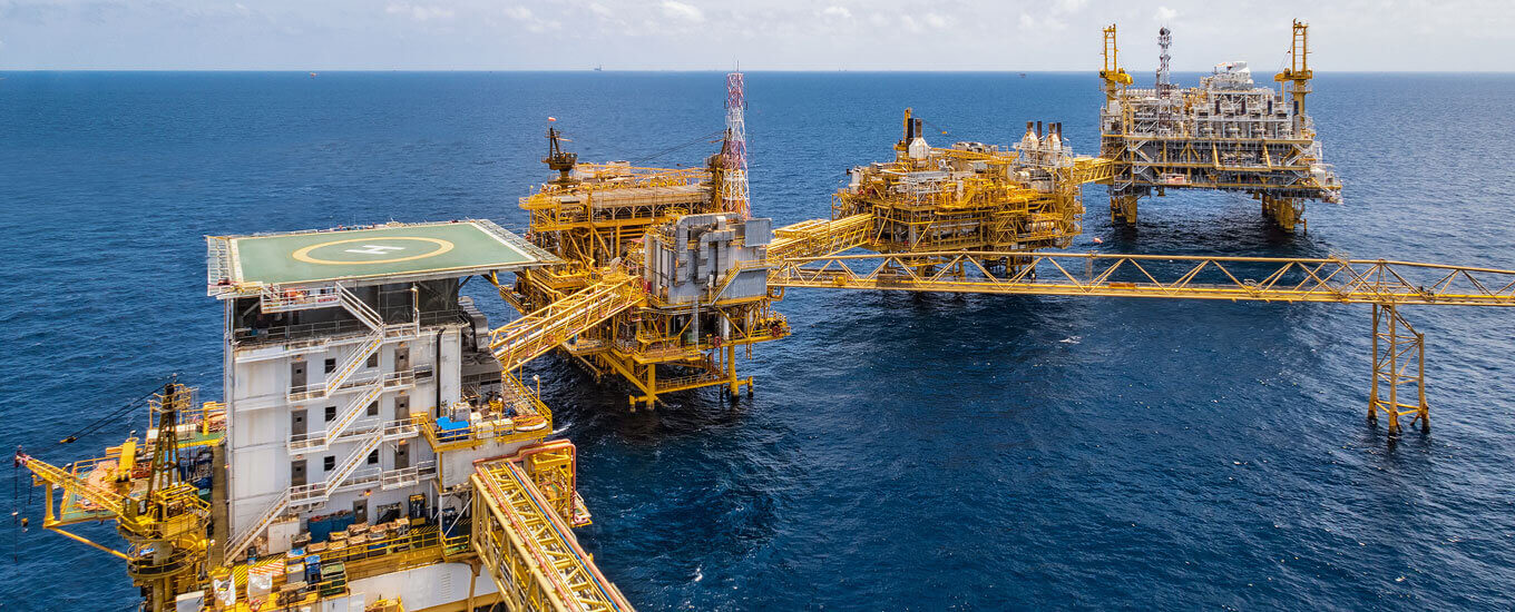 aerial shot of an oil rig in the ocean