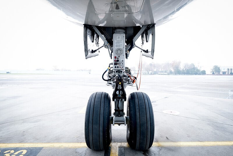 close-up of an airplane wheel and leg